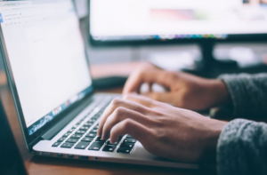 typing on laptop